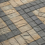 Ledgestone Smooth 4 1/2 x 4 1/2 pavers installed in a decorative patio pattern with contrasting borders.