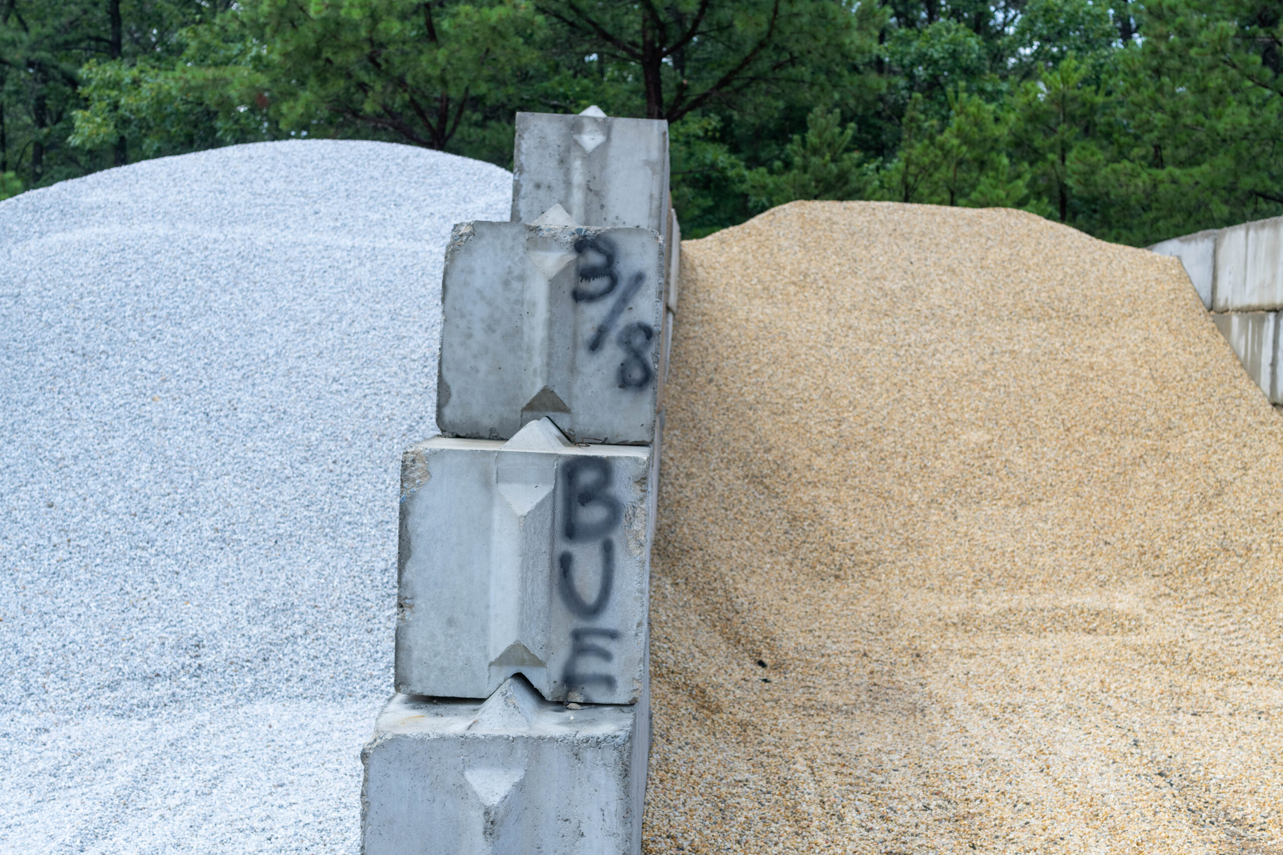 Concrete blocks and gravel piles.